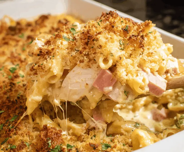 Delicious Chicken Cordon Bleu Casserole featuring breaded chicken, ham, melted cheese, and crispy topping served in a baking dish