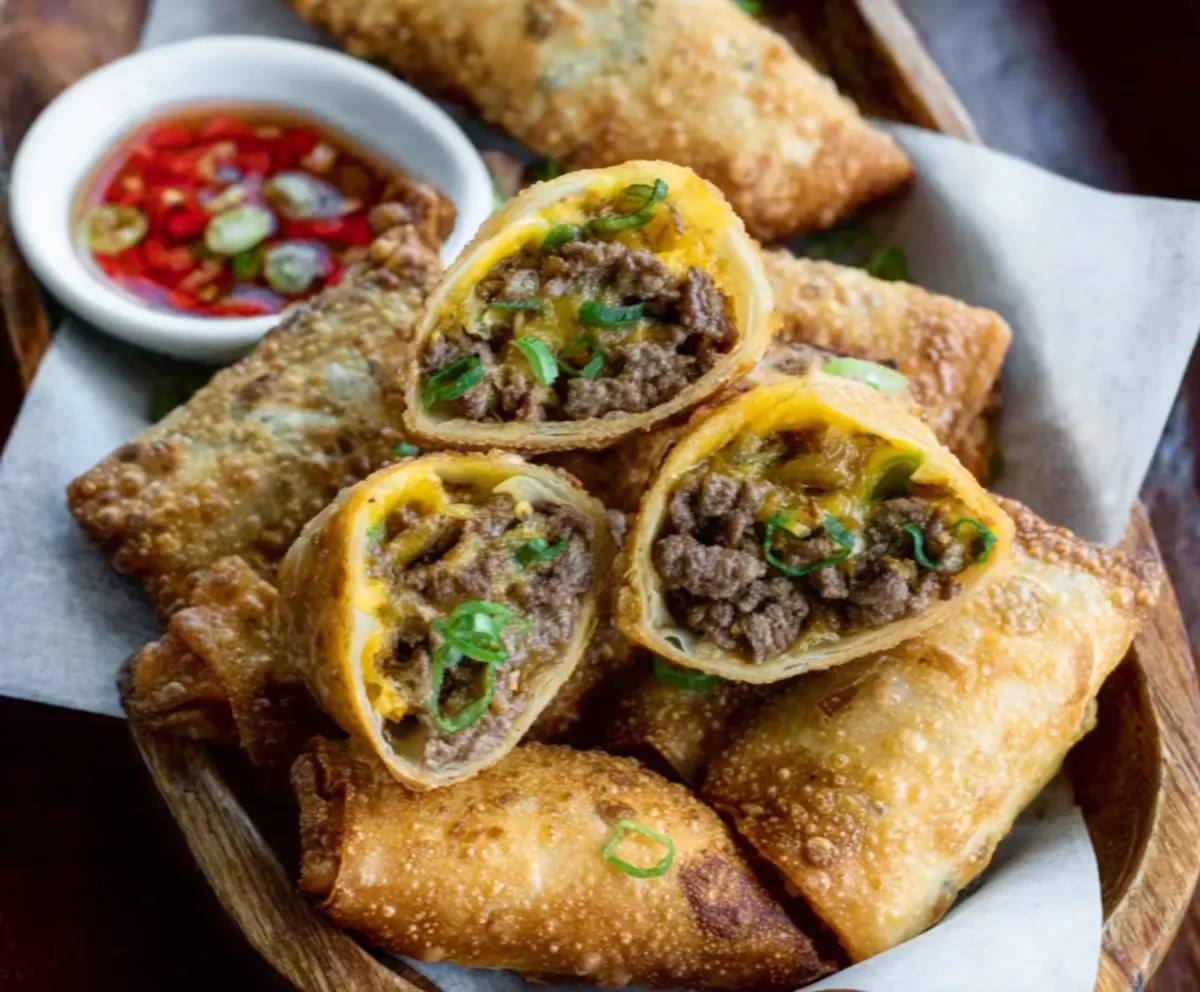 Delicious Philly Cheesesteak Egg Rolls with melted cheese and savory steak filling.